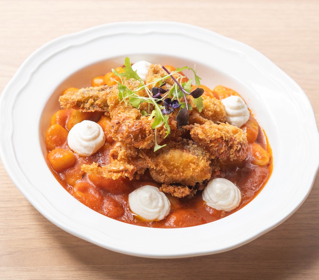 Tom yum napoli gnocchi topped with crispy soft-shell crab